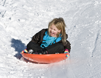 Child sledding in Telluride