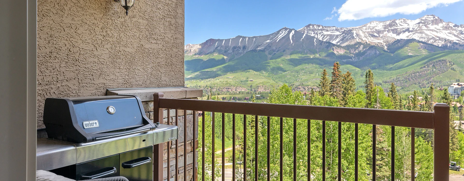 1.2-lorian-luxe-mountain-village-living-room-bbq.webp