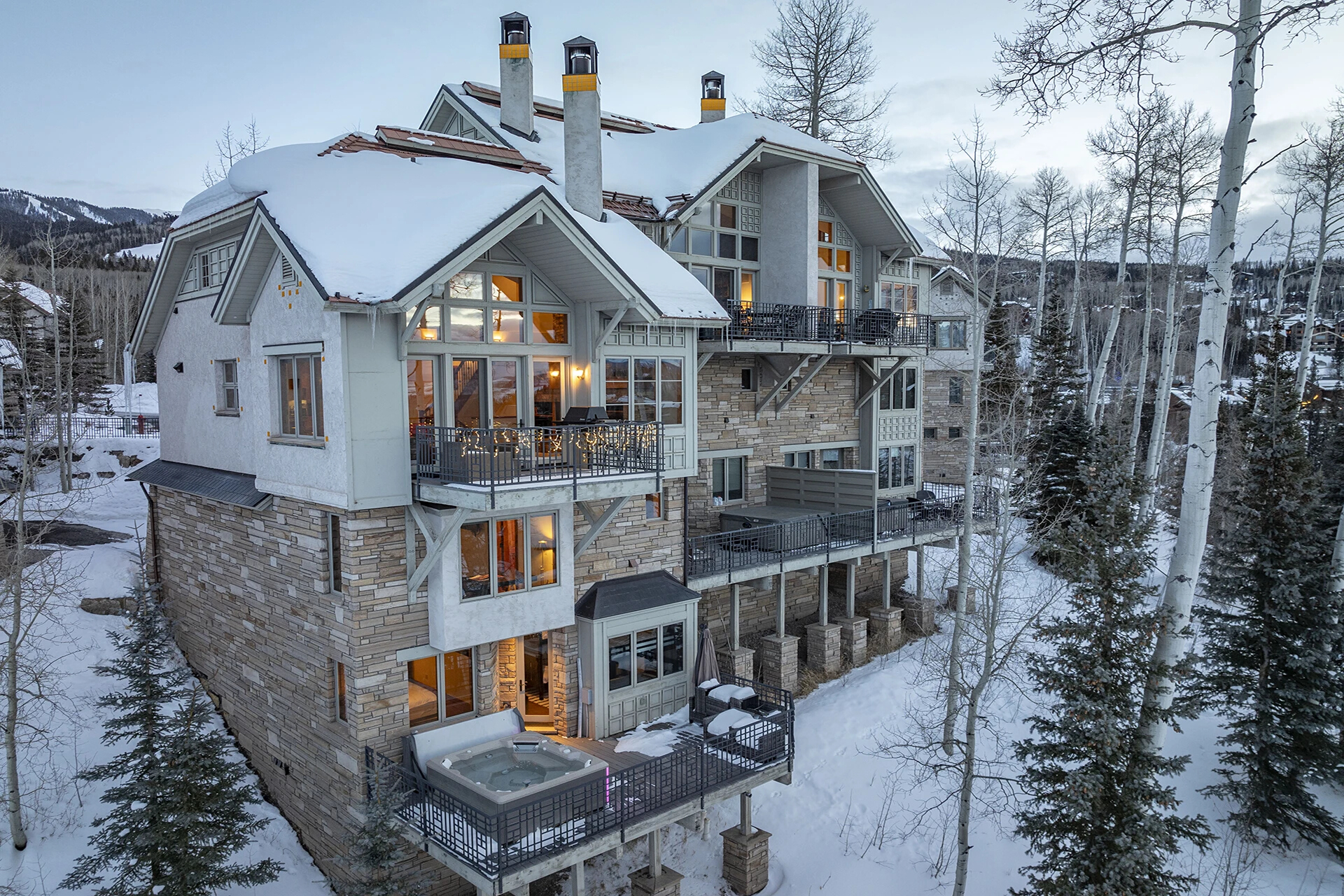 12.3-mountain-village-vacation-rental-ascent-aspen-ridge-drone-ext-glow-angle